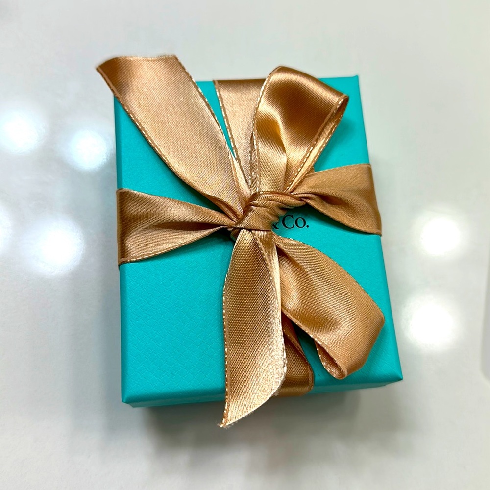 Empty Rose Gold Ribbon Tiffany and Co. Box